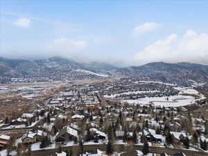 Snowy aerial view with a mountain view
