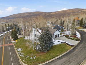 Aerial view of property's location with a mountain backdrop