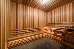 Sauna / steam room with wooden ceiling and wooden walls