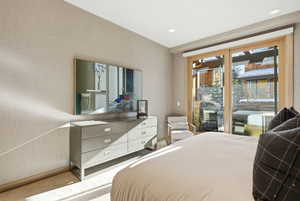 Bedroom with access to outside, carpet floors, and recessed lighting