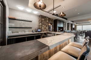 Bar with recessed lighting, light countertops, and open shelves