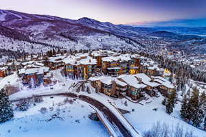 Snowy aerial view with a mountain view