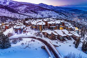 Snowy aerial view featuring a mountain view