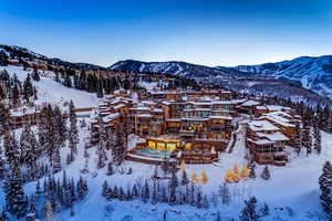 Snowy aerial view featuring a mountain view