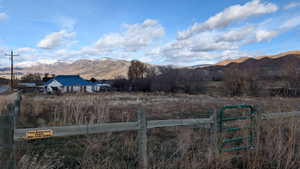 View of mountain background with rural landscape. Entire fenced area is part of parcel. View looking North.