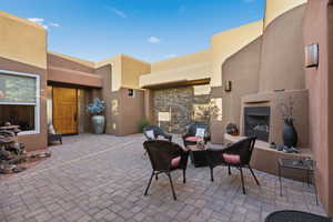 View of patio / terrace with an outdoor fireplace