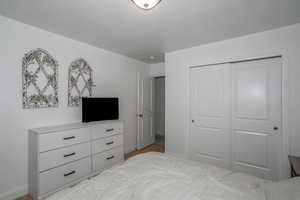 Bedroom featuring a closet and baseboards