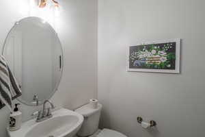 Bathroom featuring a sink and toilet