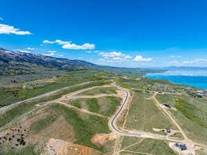 Overview of rural landscape featuring a water and mountain view