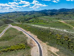 Aerial view of sparsely populated area with a mountain backdrop