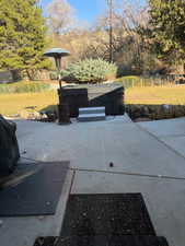 View of patio / terrace with a hot tub