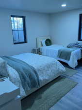Bedroom featuring wood finished floors and recessed lighting