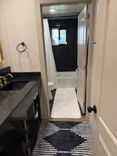 Bathroom with vanity and shower / tub combo