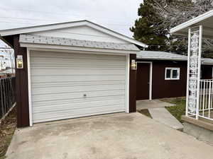 Garage with concrete driveway