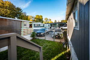 View of vehicle parking featuring a gate