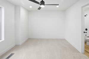 Unfurnished room with light carpet, recessed lighting, and a ceiling fan