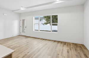 Empty room featuring light wood-style floors and baseboards