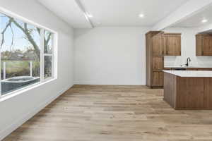 Kitchen featuring brown cabinets, light wood-style floors, and recessed lighting