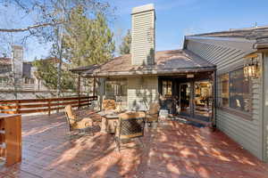 Wooden terrace with an outdoor fire pit