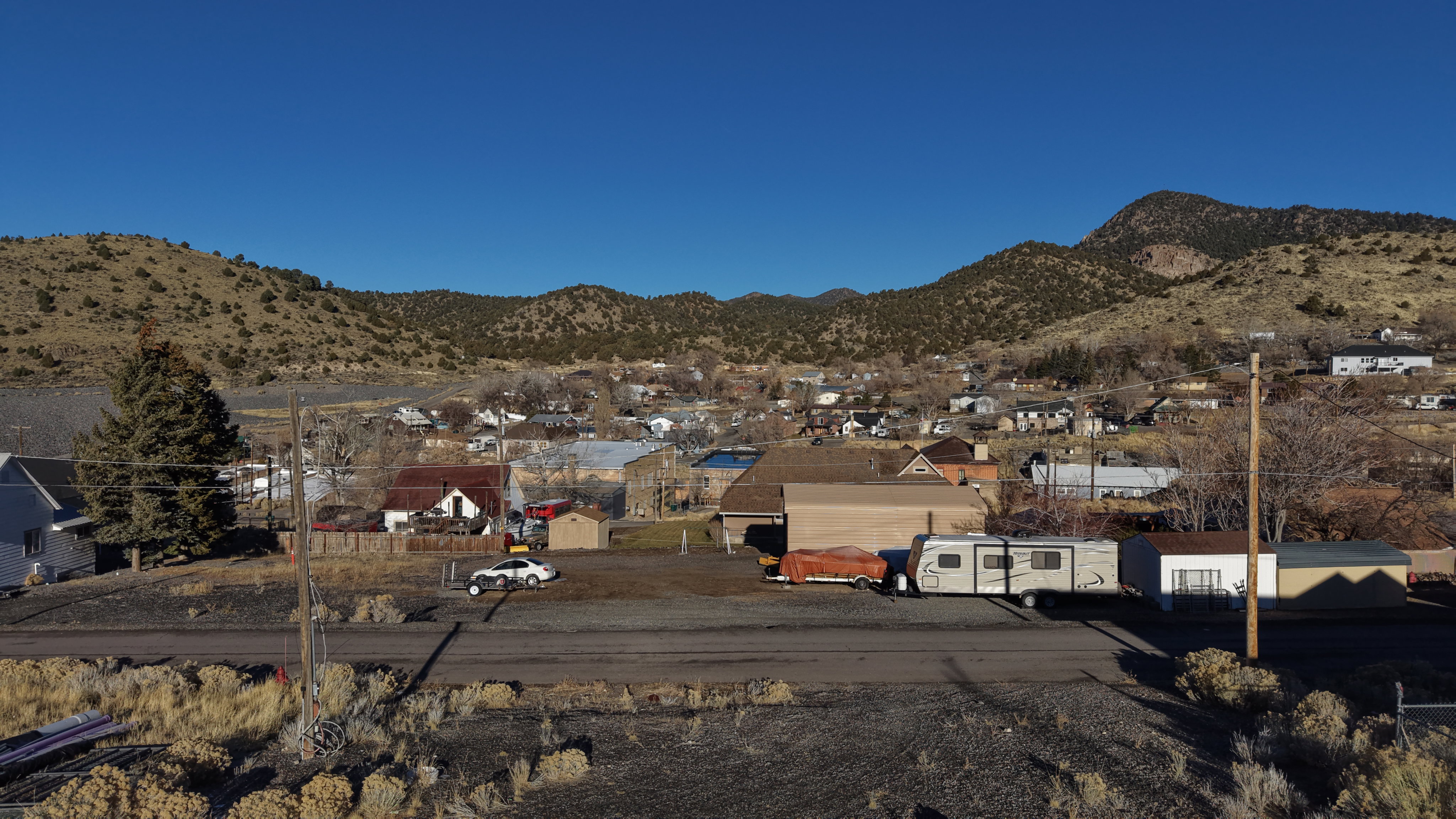 View of mountain backdrop featuring nearby suburban area