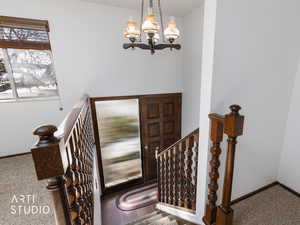 Entrance foyer featuring a chandelier