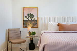 Carpeted bedroom with baseboards