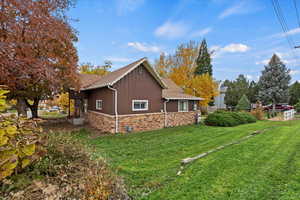 View of home's exterior featuring roof with shingles