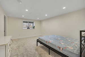 Bedroom featuring recessed lighting and light colored carpet