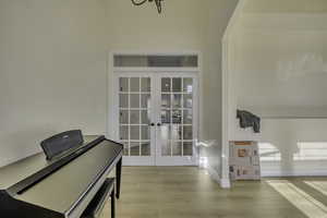 Sitting room featuring french doors and wood finished floors