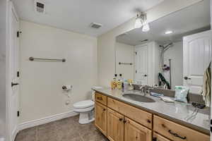 Full bathroom featuring vanity and light tile patterned flooring