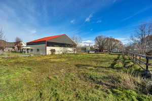 View of yard featuring an outbuilding and an outdoor structure