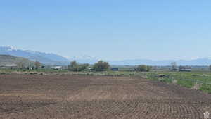 View of mountain background featuring rural landscape