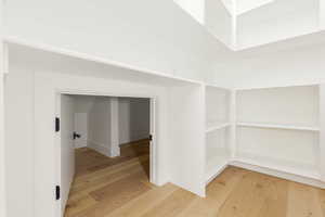 Hallway featuring light wood-type flooring