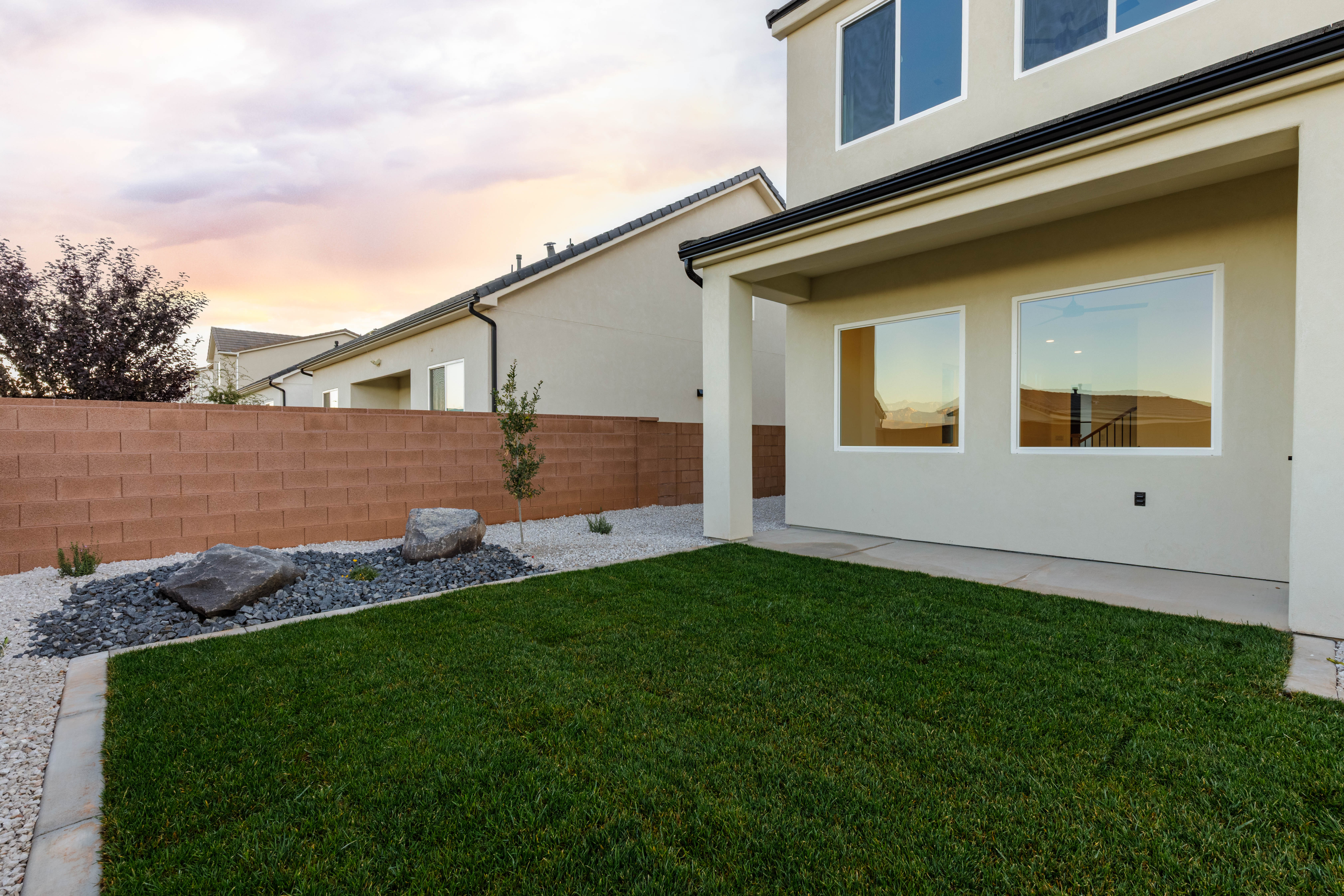 Fenced backyard with a patio