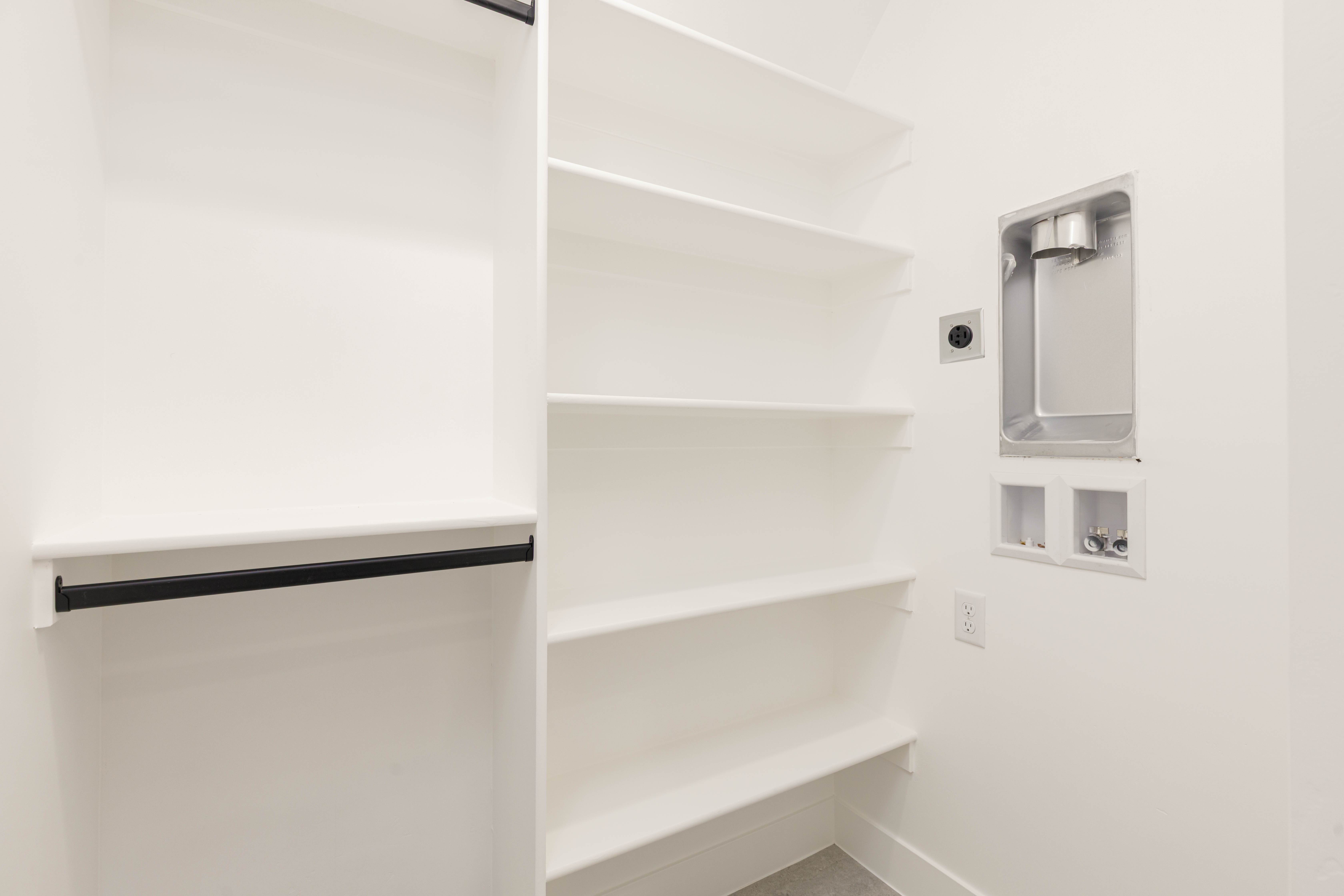 Laundry room with hookup for a washing machine and baseboards