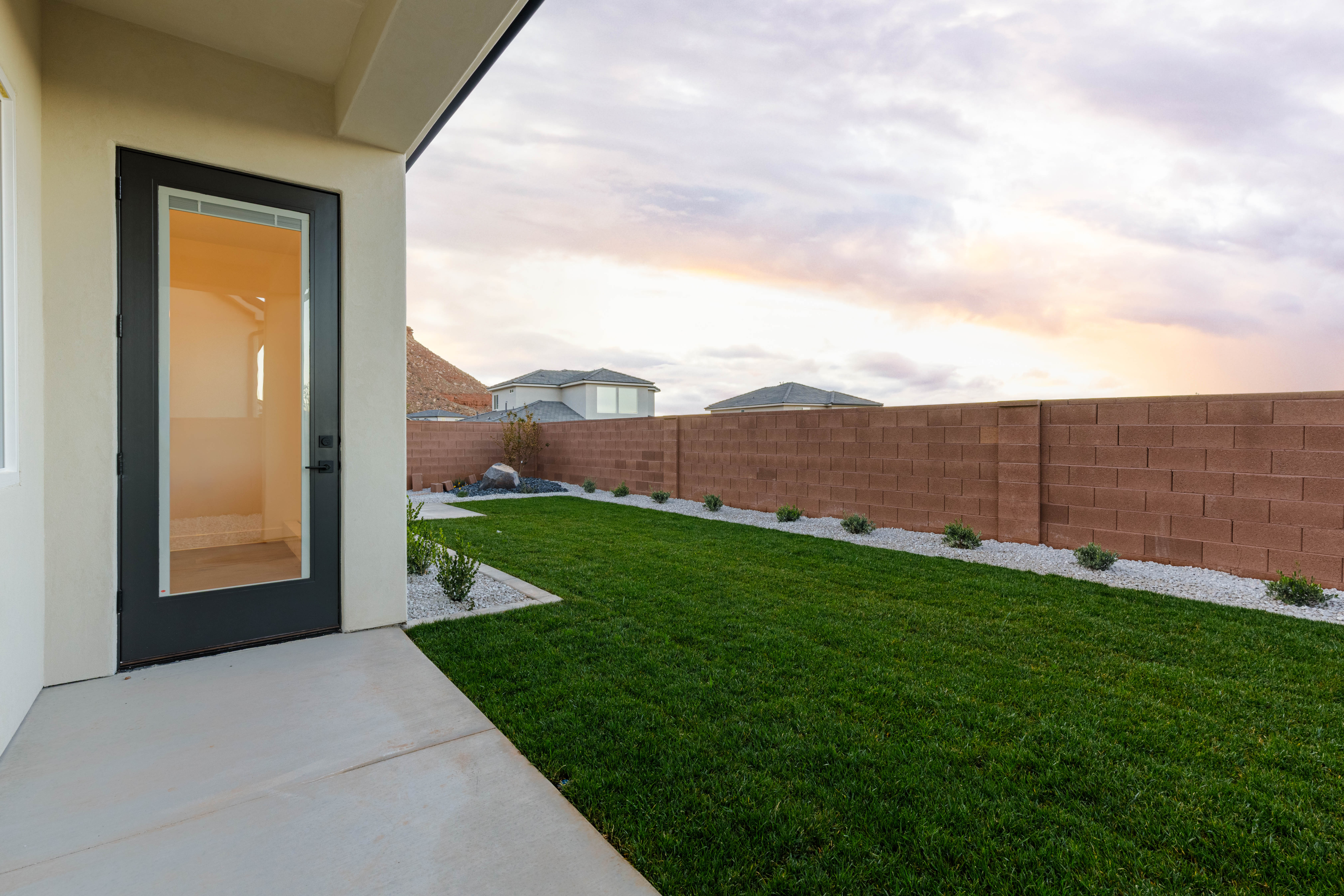 Fenced backyard with a patio