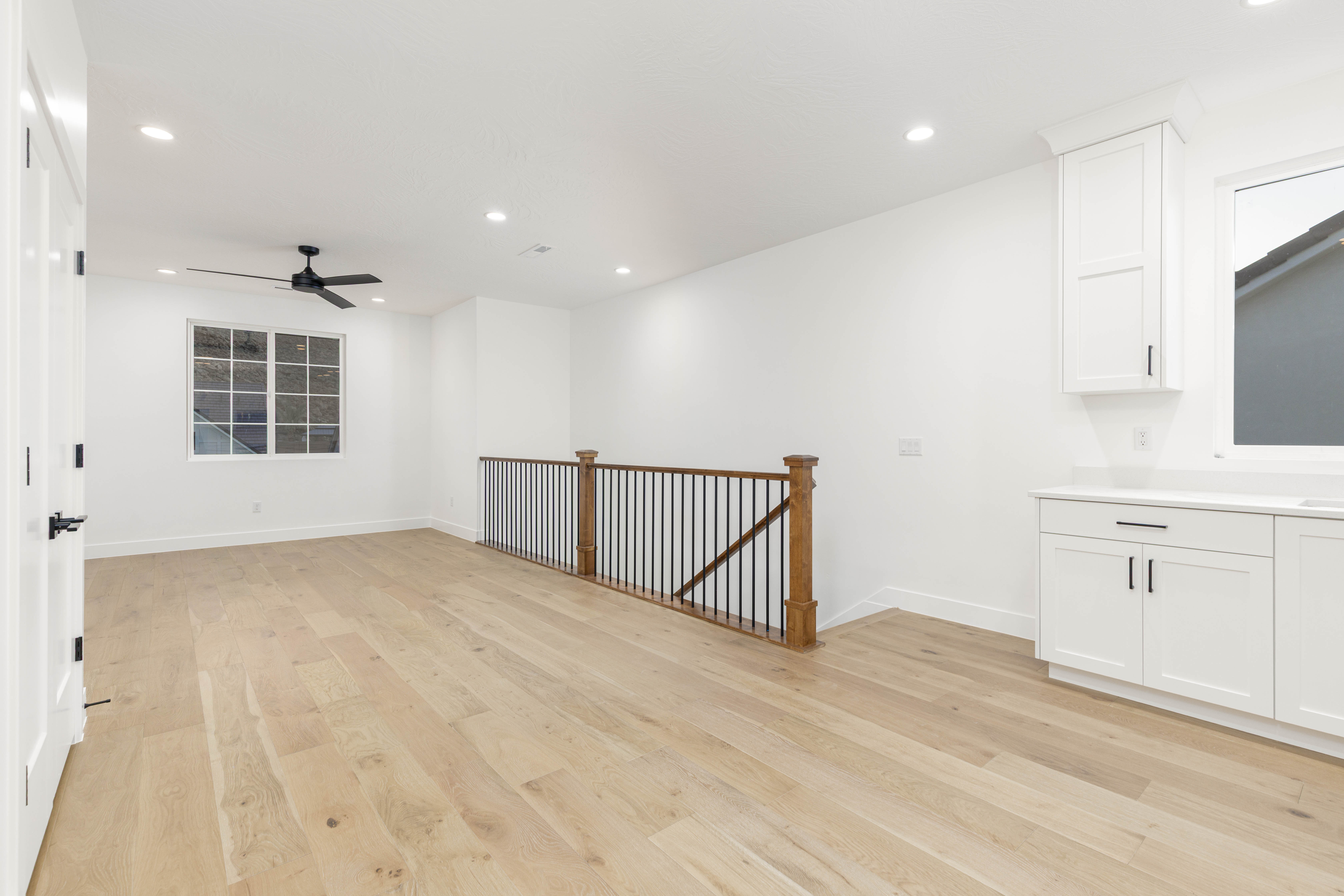 Spare room with light wood-type flooring, recessed lighting, and a ceiling fan