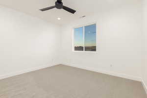 Spare room with carpet, recessed lighting, and ceiling fan