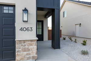 Doorway to property with stucco siding
