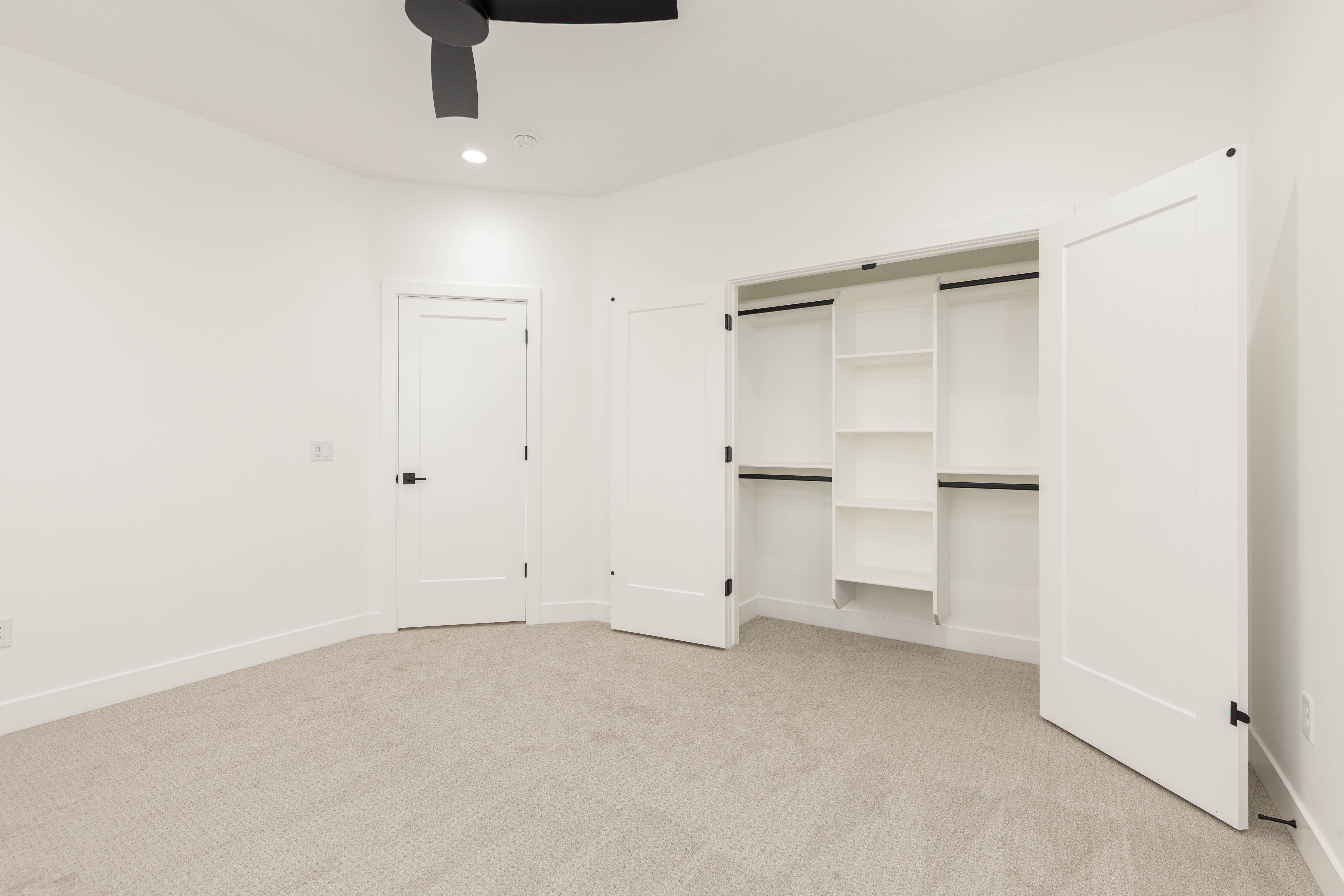 Unfurnished bedroom with light colored carpet, ceiling fan, a closet, and recessed lighting