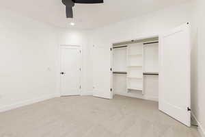 Unfurnished bedroom with light colored carpet, ceiling fan, a closet, and recessed lighting