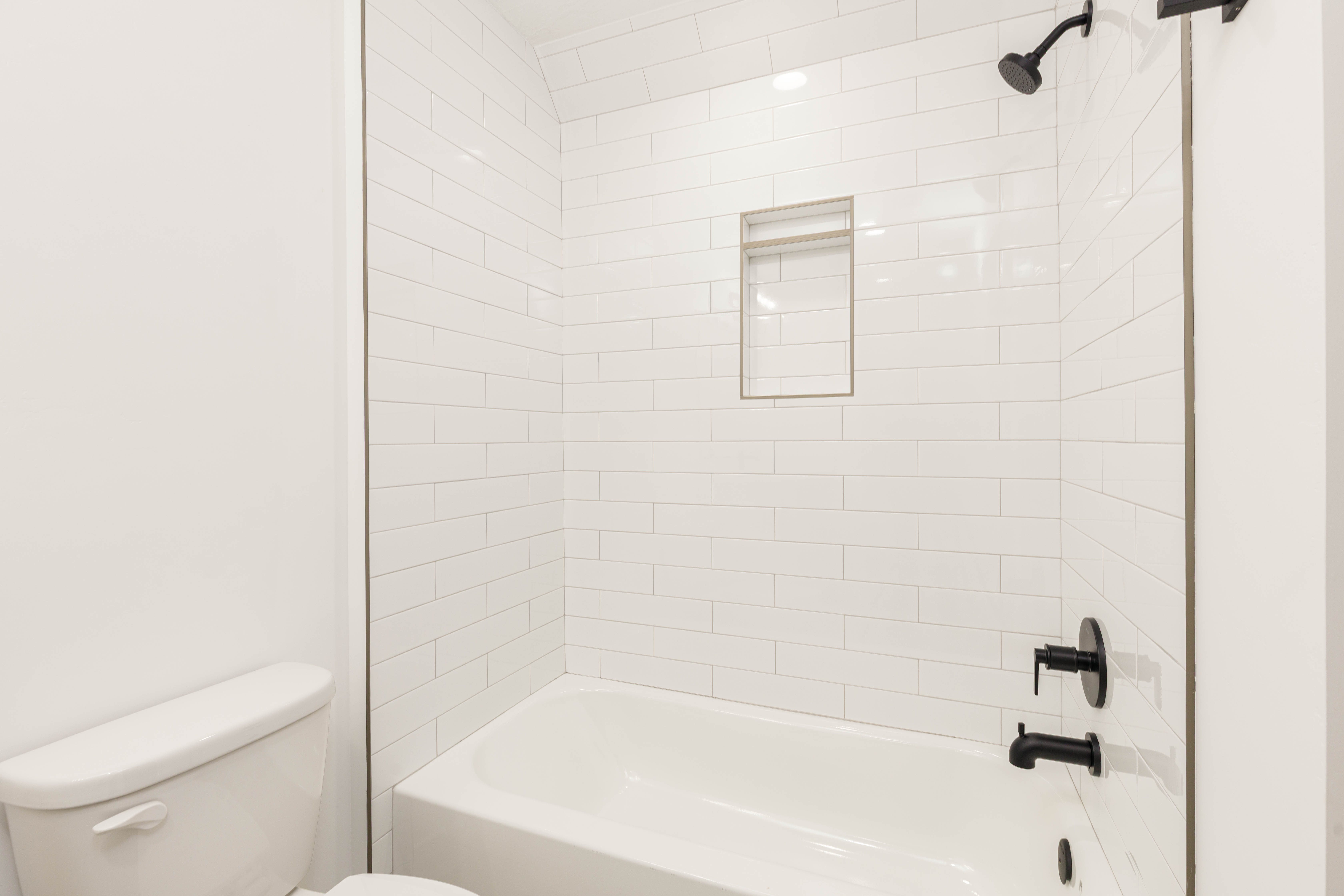 Full bath with tub / shower combination and toilet