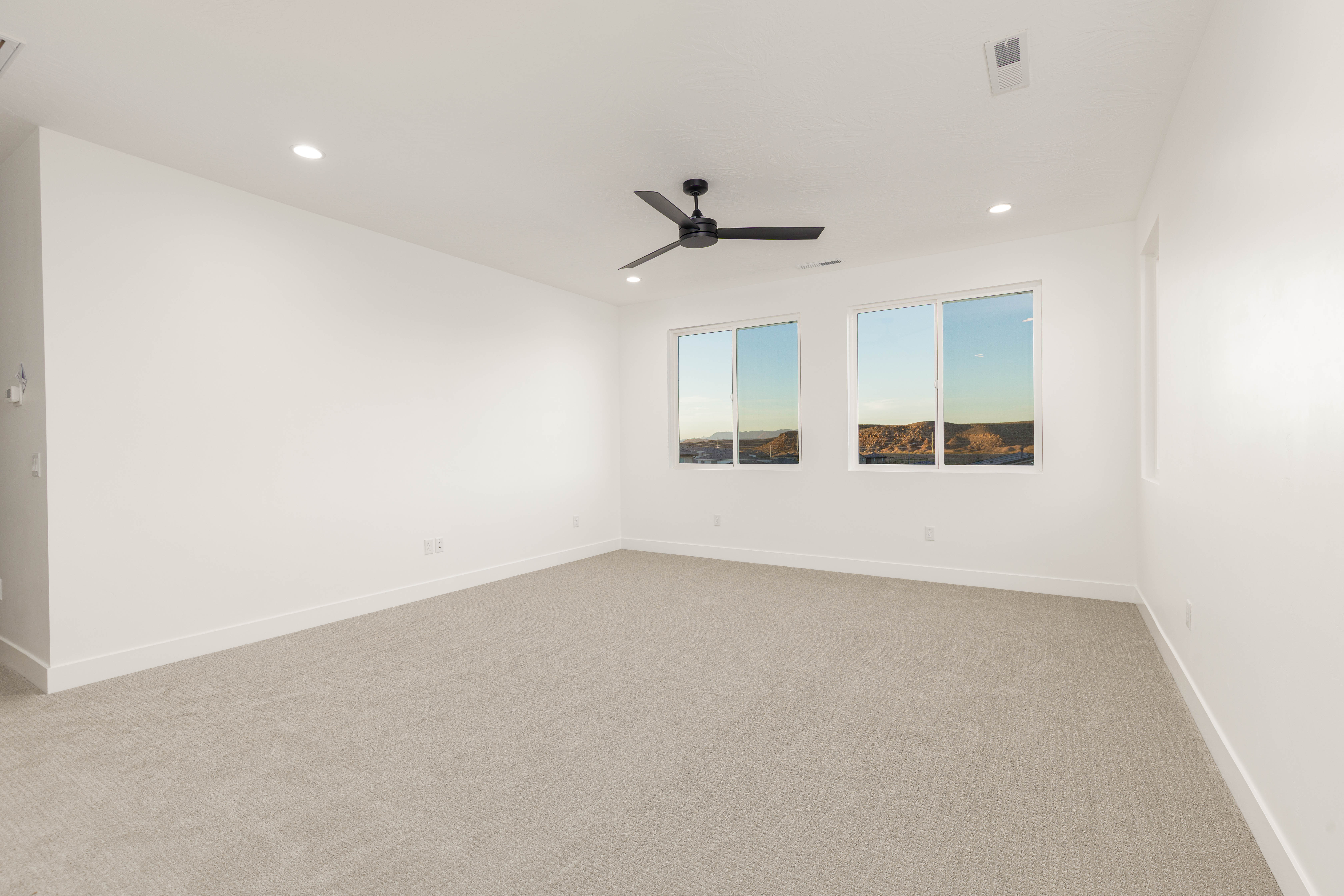 Unfurnished room featuring light colored carpet, recessed lighting, and ceiling fan