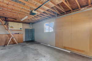 Garage with storage and an area prepped for a heater if so desired.