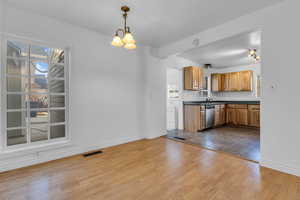 Natural lighting in dining room thanks to the spacious window and openness of the adjoining kitchen!