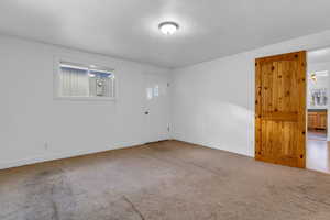 Bedroom off of dining room, has outside door that leads to breezeway to the garage.