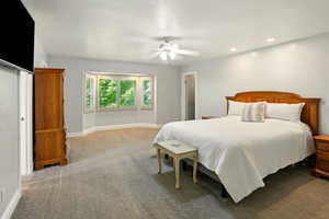 Bedroom featuring carpet, ceiling fan, and recessed lighting