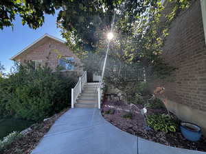Entrance to property featuring brick siding