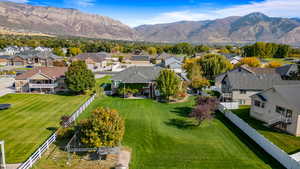 Aerial perspective of suburban area featuring a mountainous background