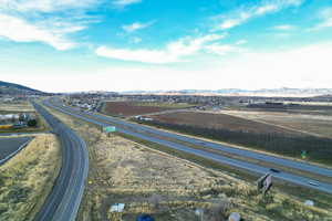 View of property location with a mountainous background and a highway